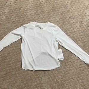 White lululemon rise and run long sleeve.